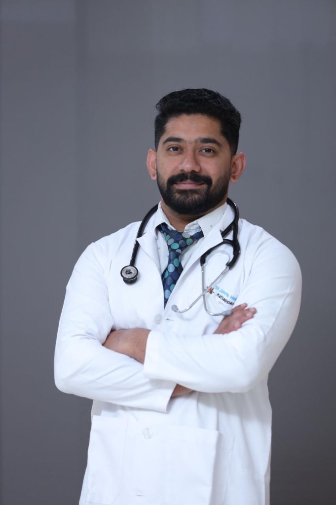 Portrait of Dr Sharath Varghese Jose in a white coat